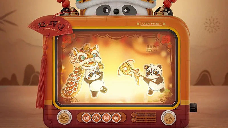Decorative toy with panda and dragon design on a vintage television set, featuring LOZ branding.